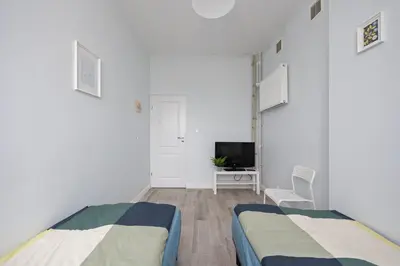 Telewizja i/lub zestaw kina domowego w obiekcie Pokoje Metro Pole Mokotowskie