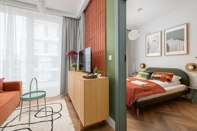 Łóżko lub łóżka w pokoju w obiekcie RentPlanet - Apartament przy Dworcu Centralnym