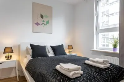 Łóżko lub łóżka w pokoju w obiekcie Urban Chic - 2 Bedrooms - Rondo ONZ - Luxury Warsaw Stays - Pereca street