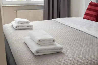 Łóżko lub łóżka w pokoju w obiekcie Wola Sławińska Deluxe Apartment by BookingHost