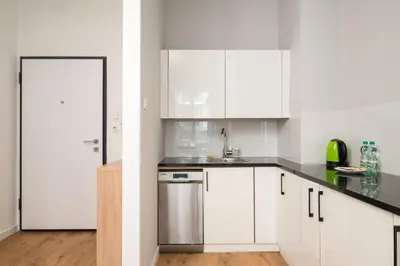 Kuchnia lub aneks kuchenny w obiekcie Wola Sławińska Deluxe Apartment by BookingHost