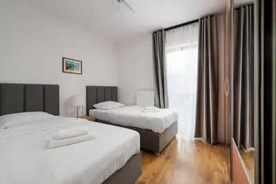 Łóżko lub łóżka w pokoju w obiekcie Bemowo 2-Bedroom Apartment by BookingHost