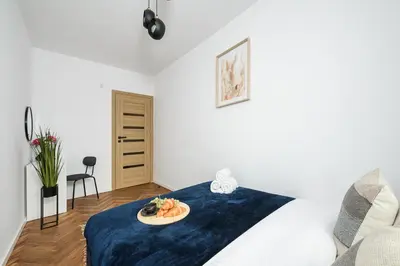 Łóżko lub łóżka w pokoju w obiekcie Lumina 2-room apartment near the Old Town