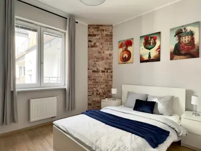 Łóżko lub łóżka w pokoju w obiekcie T&M Apartments FVAT Invoice