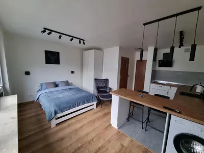Łóżko lub łóżka w pokoju w obiekcie Kawalerka w Centrum Warszawy - 300 metrów od PKiN Self check-in