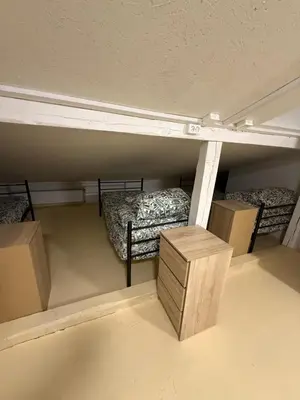 Łóżko lub łóżka w pokoju w obiekcie Hostel PULSE