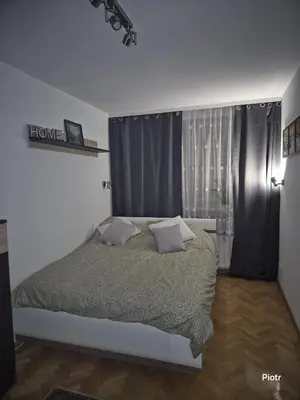 Łóżko lub łóżka w pokoju w obiekcie Apartament Dzielna 78