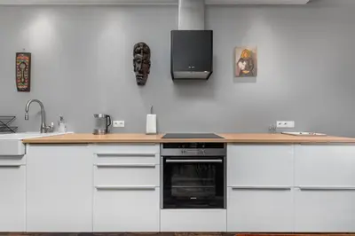 Kuchnia lub aneks kuchenny w obiekcie Ledóchowskiej 5A by Homeprime