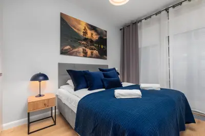 Łóżko lub łóżka w pokoju w obiekcie Kolejowa 45B by Homeprime