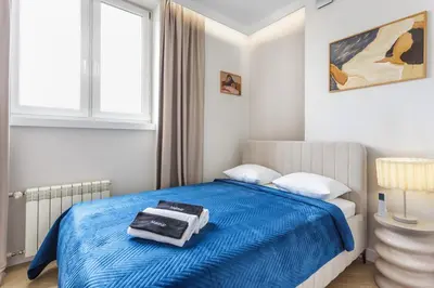 Łóżko lub łóżka w pokoju w obiekcie Almond Penthouse Apartment