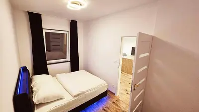 Łóżko lub łóżka w pokoju w obiekcie GOLD APARTAMENT Ząbki