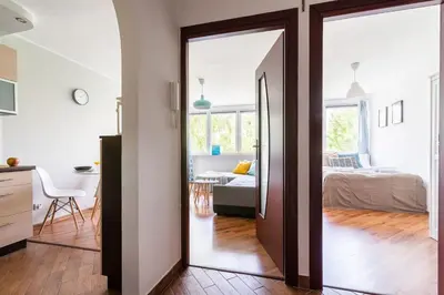 Łóżko lub łóżka w pokoju w obiekcie Spacious & Bright Apartment on Mokotow by Noclegi Renters