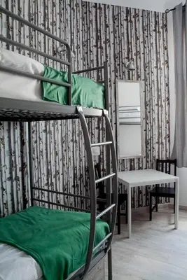 Łóżko lub łóżka w pokoju w obiekcie Hostel Lwowska 11