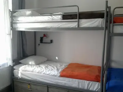 Łóżko lub łóżka w pokoju w obiekcie Hostel Lwowska 11