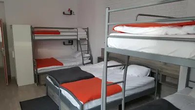Łóżko lub łóżka w pokoju w obiekcie Hostel Lwowska 11