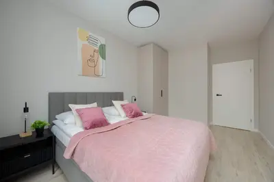 Łóżko lub łóżka w pokoju w obiekcie Modern & Bright Apartment Marywilska in Warsaw with Parking by Noclegi Renters