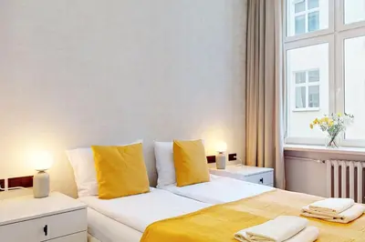 Łóżko lub łóżka w pokoju w obiekcie Lumiere Apartment City Center Hoza