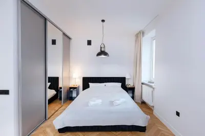 Łóżko lub łóżka w pokoju w obiekcie Nowy Świat 47 Urban Classic by Solarento