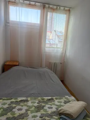 Łóżko lub łóżka w pokoju w obiekcie Zakątek