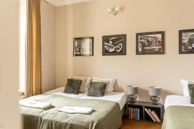 Łóżko lub łóżka w pokoju w obiekcie Warsaw Concierge Wilcza