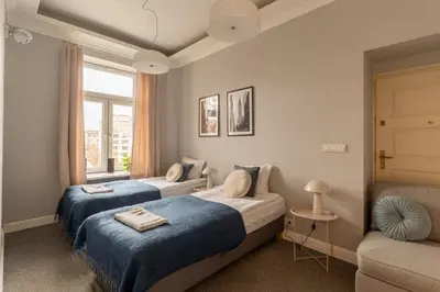 Łóżko lub łóżka w pokoju w obiekcie Warsaw Concierge Wilcza