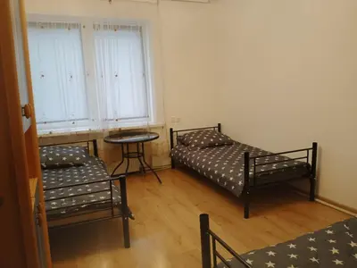 Łóżko lub łóżka w pokoju w obiekcie Iriska Home