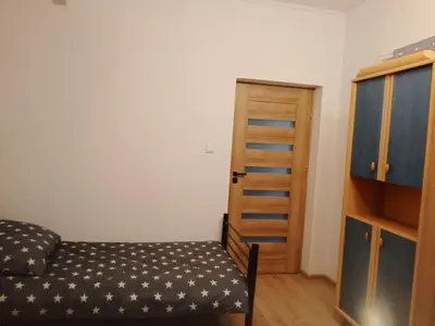 Łóżko lub łóżka w pokoju w obiekcie Iriska Home