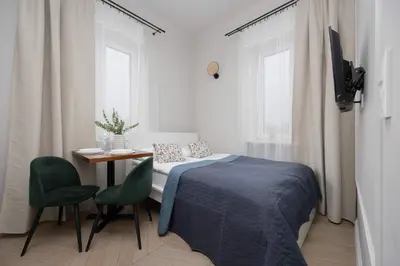 Łóżko lub łóżka w pokoju w obiekcie Budget-Friendly Mokotów Micro-Apartment For 2 Guests in Warsaw by Noclegi Renters
