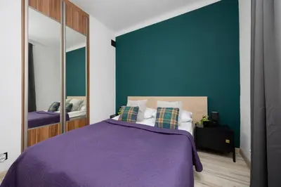 Łóżko lub łóżka w pokoju w obiekcie Vibrant Mokotów Business Centre Apartment Warsaw by Noclegi Renters