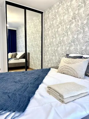 Łóżko lub łóżka w pokoju w obiekcie Golden Stay Luxury 3-Bedroom Apartment in Warsaw