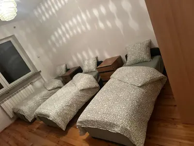 Łóżko lub łóżka w pokoju w obiekcie CityHalo Hostel