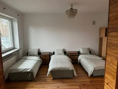 Łóżko lub łóżka w pokoju w obiekcie CityHalo Hostel