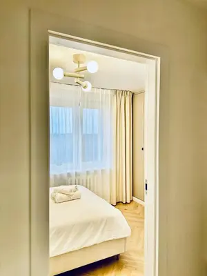 Łóżko lub łóżka w pokoju w obiekcie Darwina 15A Apartament Praga Północ