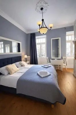 Łóżko lub łóżka w pokoju w obiekcie Ivory Studio Deluxe City Center Hoza