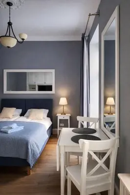 Łóżko lub łóżka w pokoju w obiekcie Ivory Studio Deluxe City Center Hoza