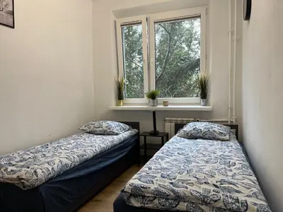 Łóżko lub łóżka w pokoju w obiekcie Pokoje Metro Imielin