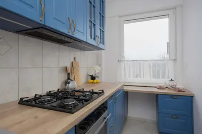 Kuchnia lub aneks kuchenny w obiekcie Apartment in Ochota with Balcony near Szczesliwicki Park by Noclegi Renters