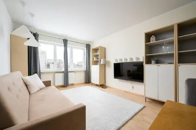 Telewizja i/lub zestaw kina domowego w obiekcie Metro Ursynów Homely Apartment by BookingHost