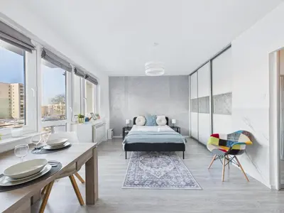 Łóżko lub łóżka w pokoju w obiekcie Sosnowskiego SuperApart - comfort on Ursynow
