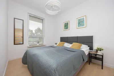 Łóżko lub łóżka w pokoju w obiekcie Elegant Apartment Szafrańców by Noclegi Renters
