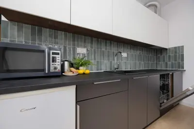 Kuchnia lub aneks kuchenny w obiekcie Elegant Apartment Szafrańców by Noclegi Renters