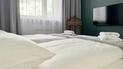Łóżko lub łóżka w pokoju w obiekcie Apartament Warszawa