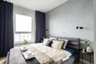 Łóżko lub łóżka w pokoju w obiekcie Herbu Oksza Apartment Ursus AC Parking by Mia