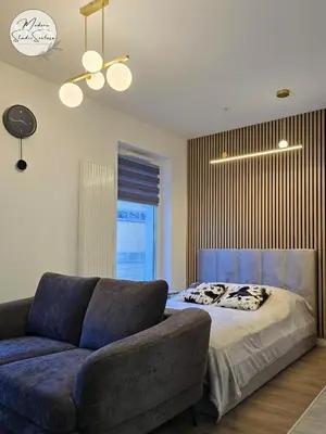Łóżko lub łóżka w pokoju w obiekcie Modern Studio Szałasa
