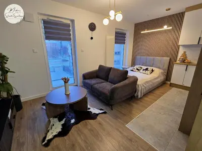 Łóżko lub łóżka w pokoju w obiekcie Modern Studio Szałasa