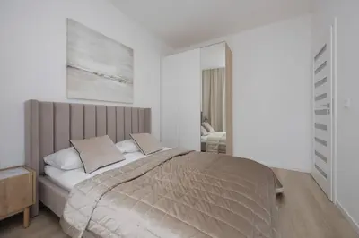 Łóżko lub łóżka w pokoju w obiekcie LUX City Center Browary Warszawskie Apartments by Noclegi Renters