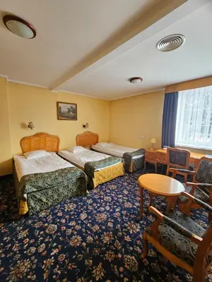 Łóżko lub łóżka w pokoju w obiekcie Folwark Historic Hotel
