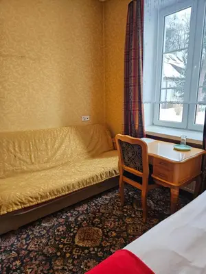 Łóżko lub łóżka w pokoju w obiekcie Folwark Historic Hotel