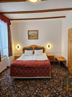 Łóżko lub łóżka w pokoju w obiekcie Folwark Historic Hotel