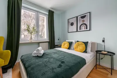 Łóżko lub łóżka w pokoju w obiekcie Lumina lux apartment with balcony in the center of Warsaw